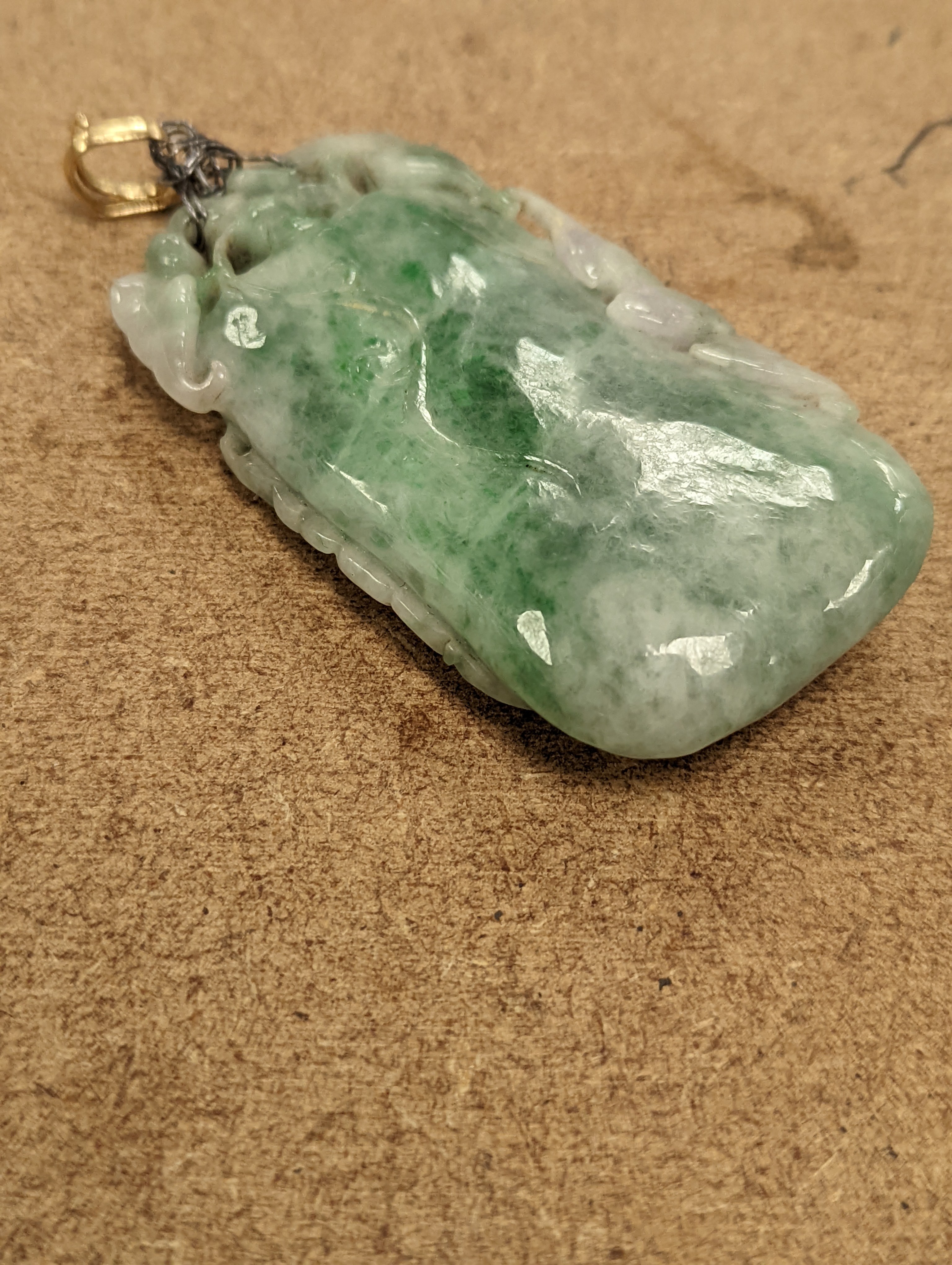A Chinese mottled jadeite plaque 8cm